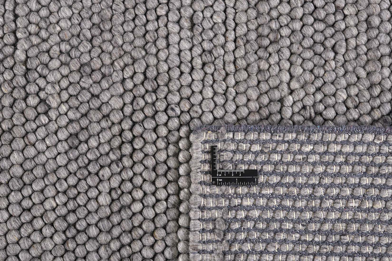 dark grey textured wool rug