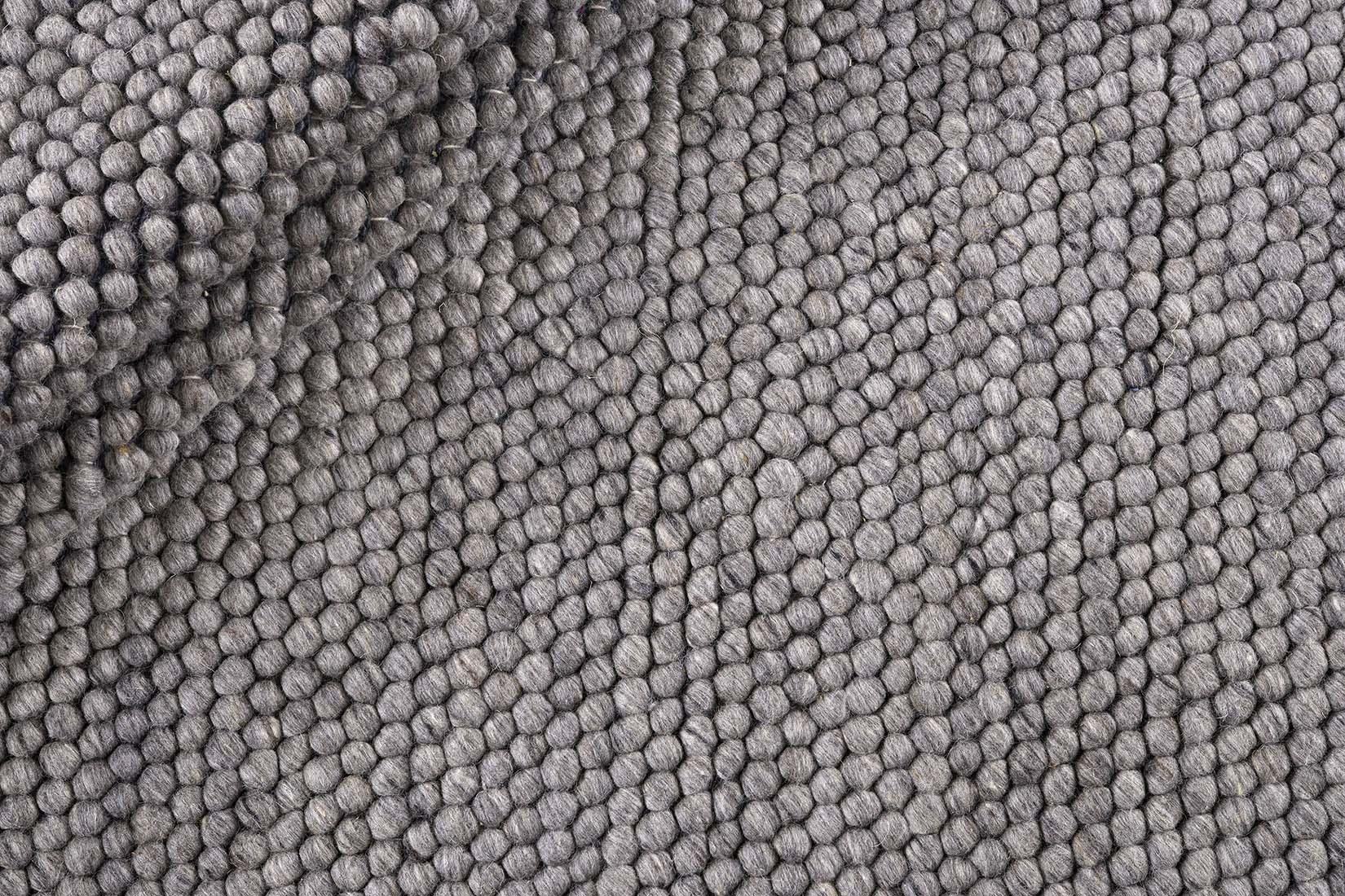 dark grey textured wool rug