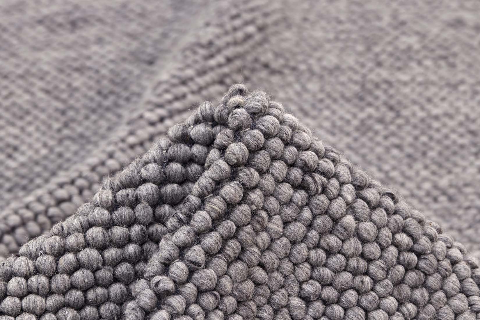 dark grey textured wool rug
