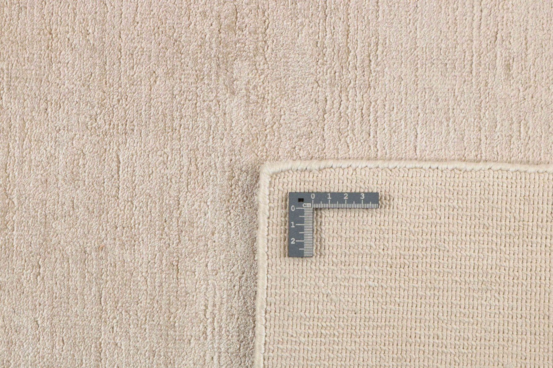 large plain beige rug
