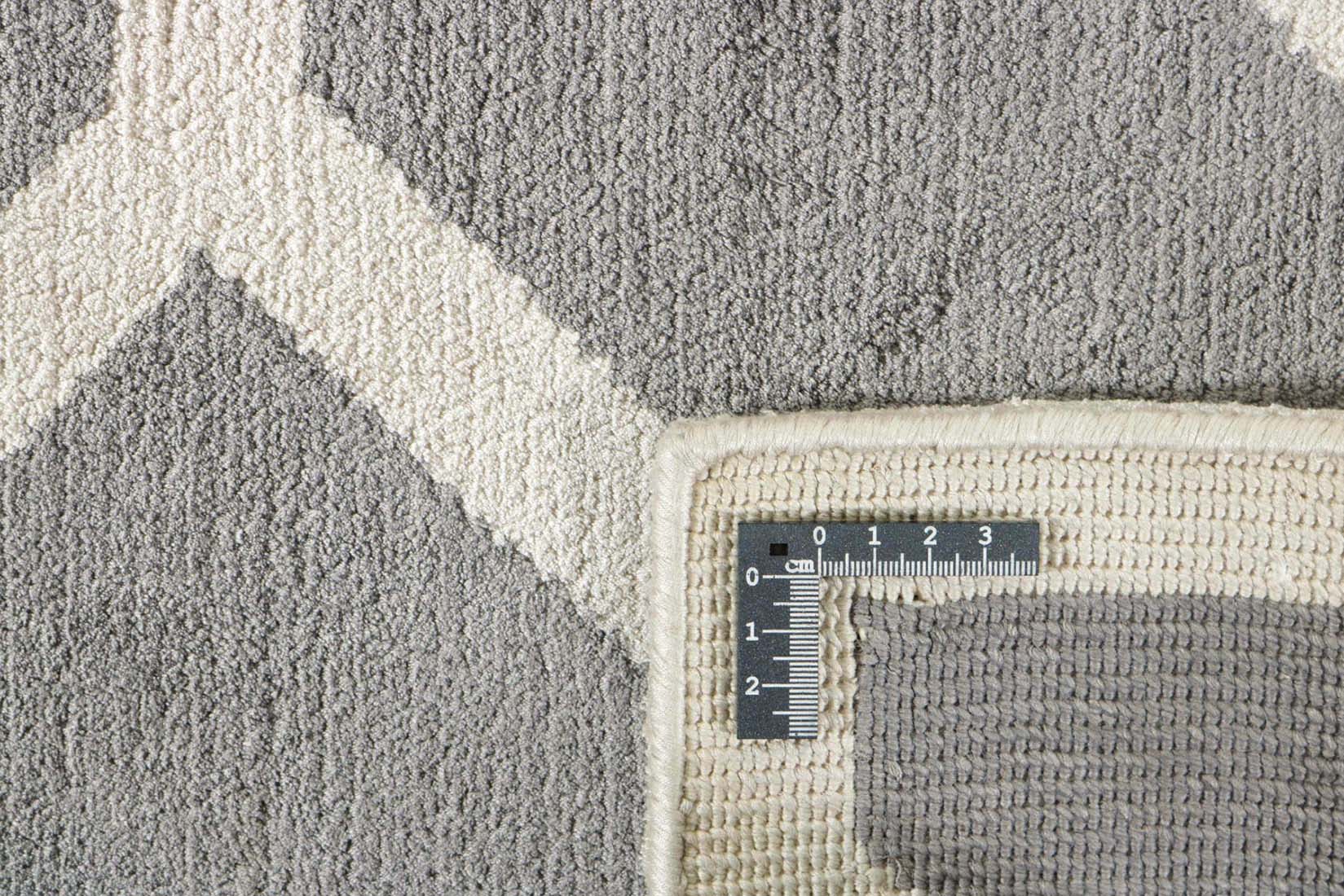 geometric area rug in grey and white