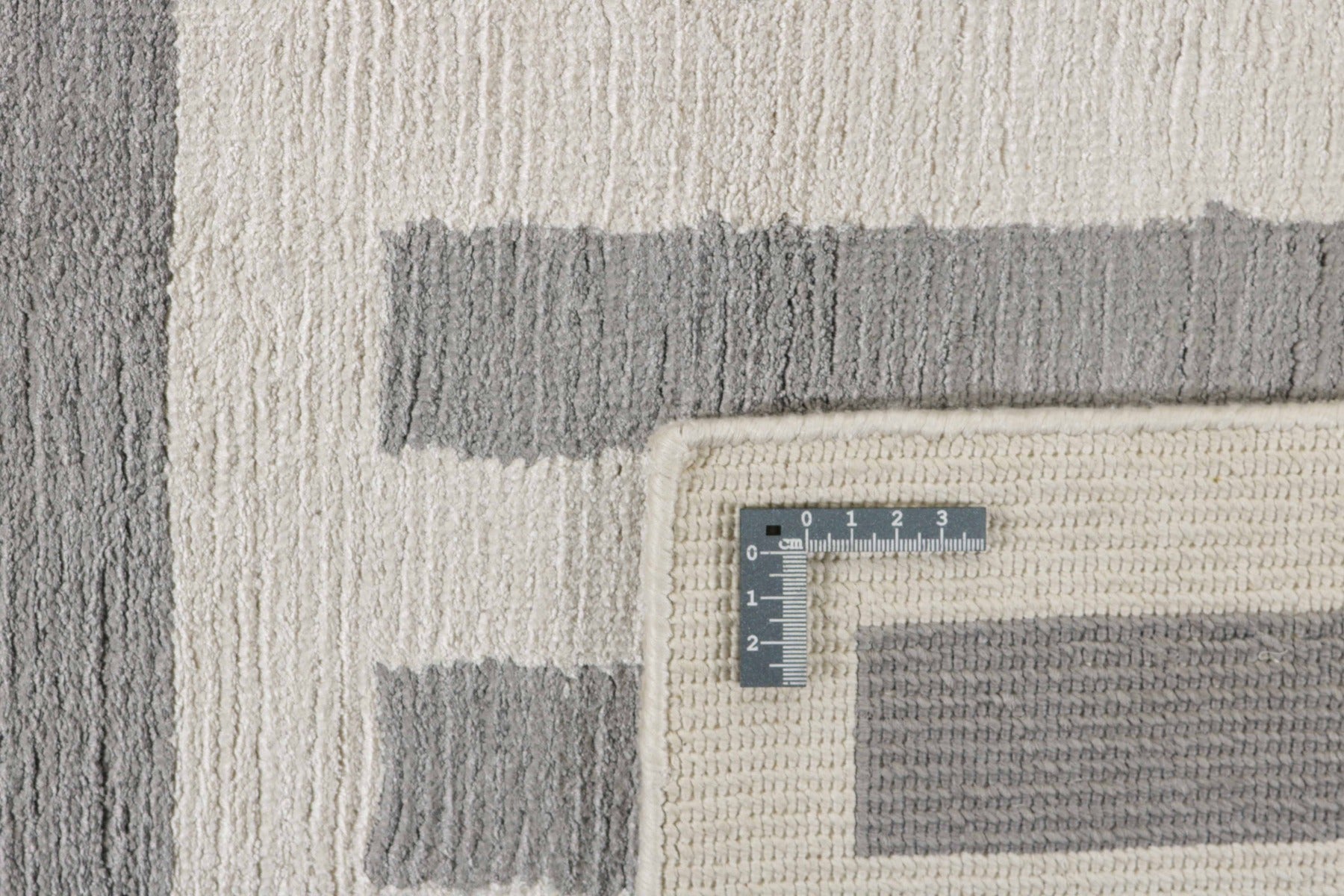 geometric area rug in grey and white