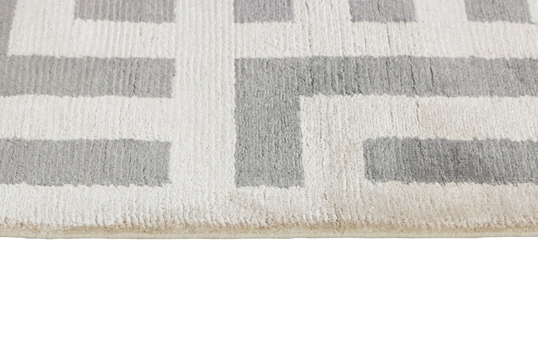 geometric area rug in grey and white