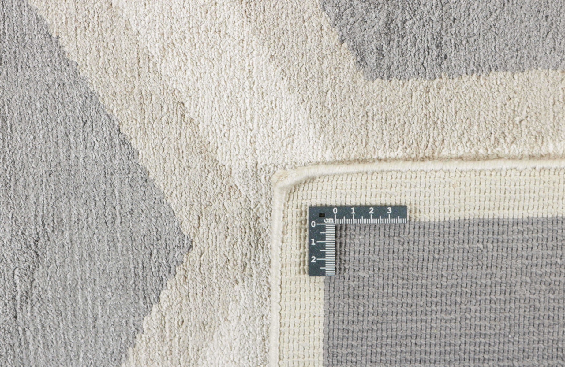 geometric area rug in grey and white