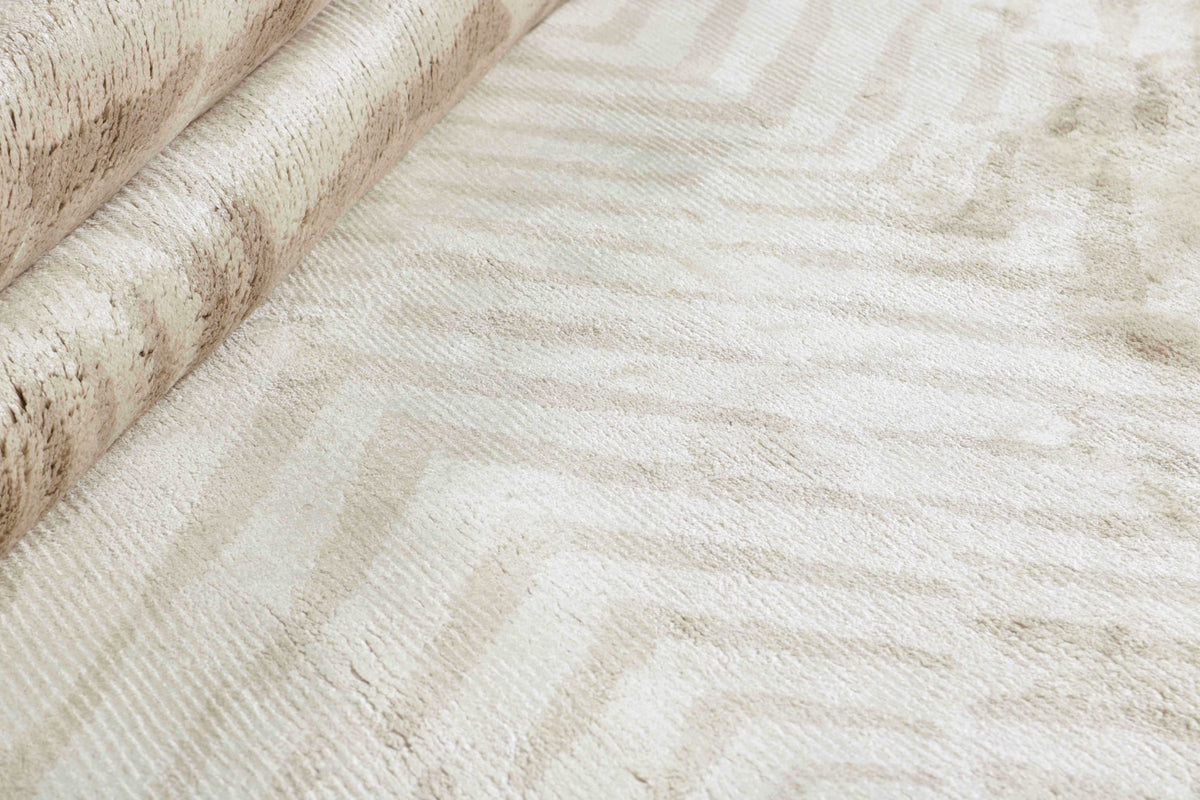 beige rug with a geometric pattern