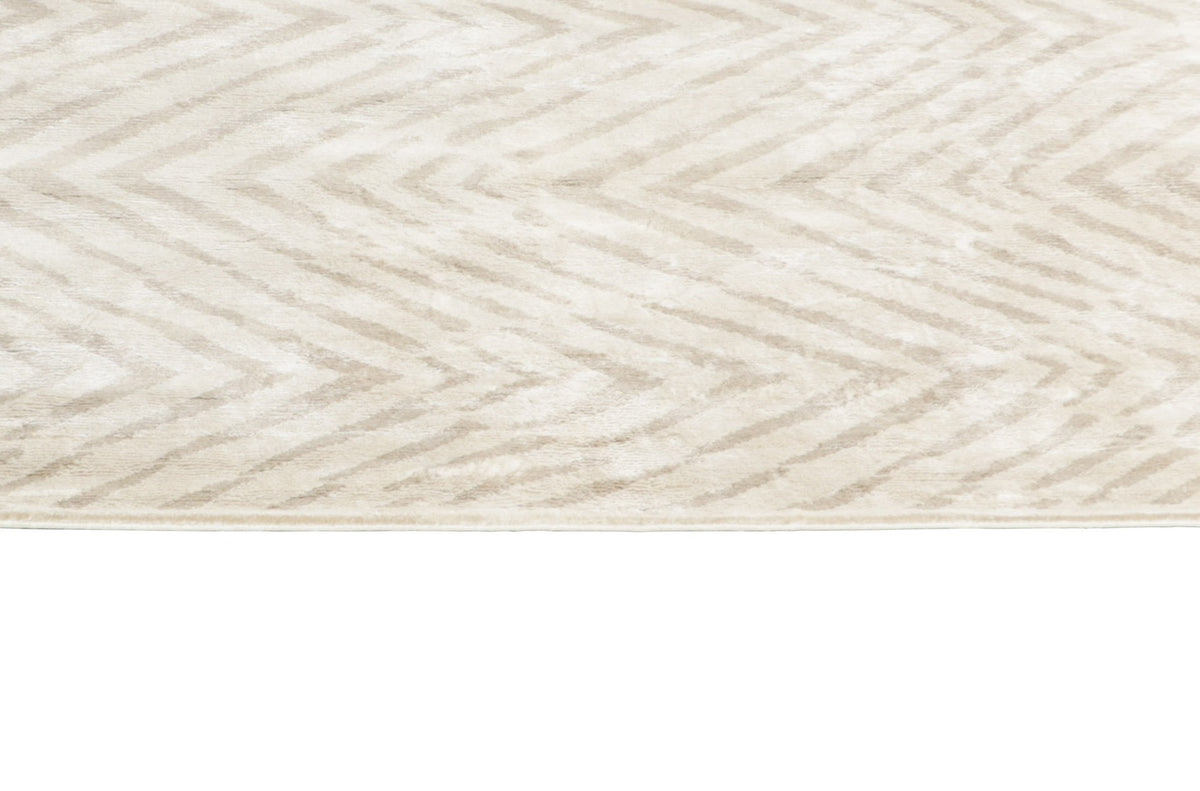 beige rug with a geometric pattern