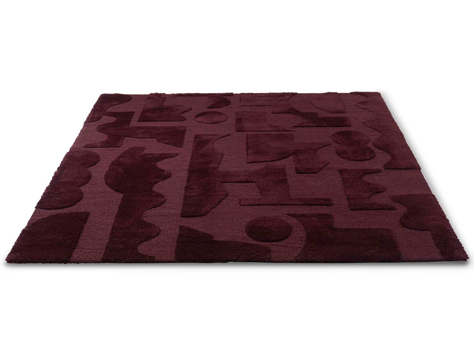 burgundy wool rug with geometric textured design