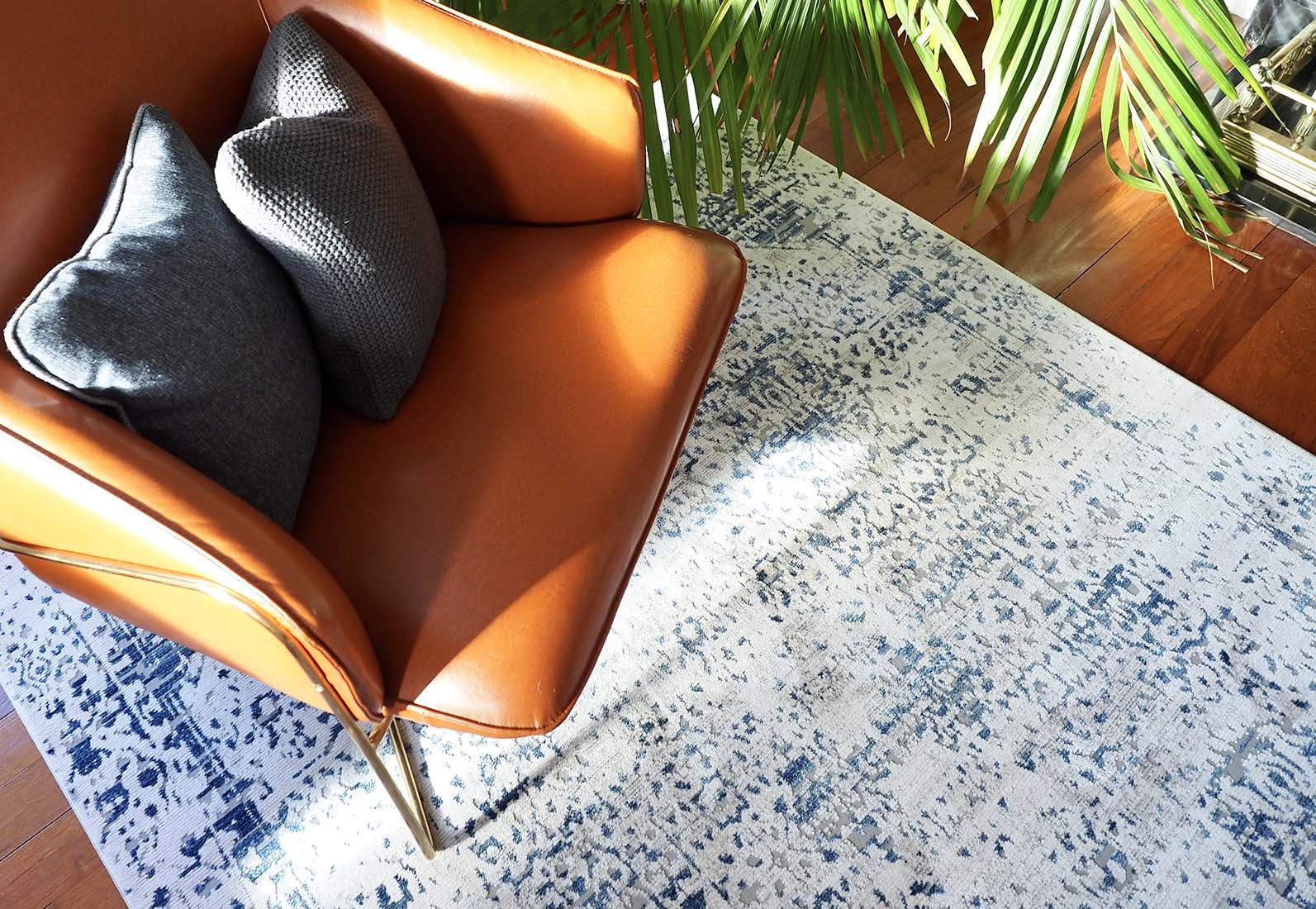 grey Persian style area rug with navy detail