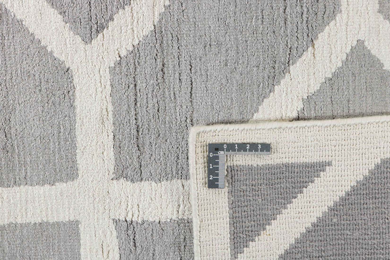 geometric area rug in grey and white