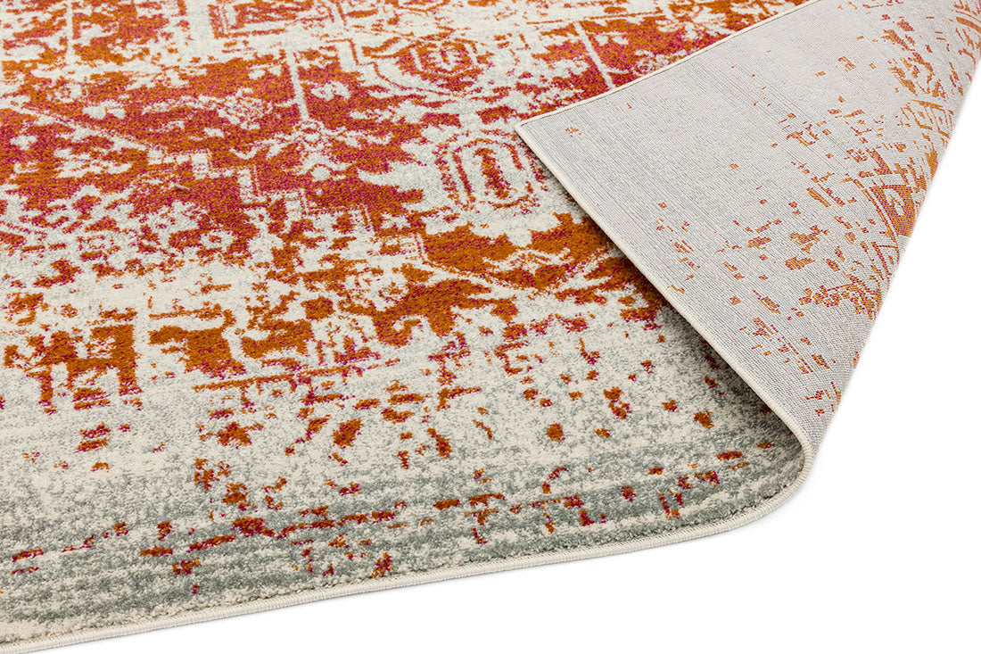 orange rug with an oriental design