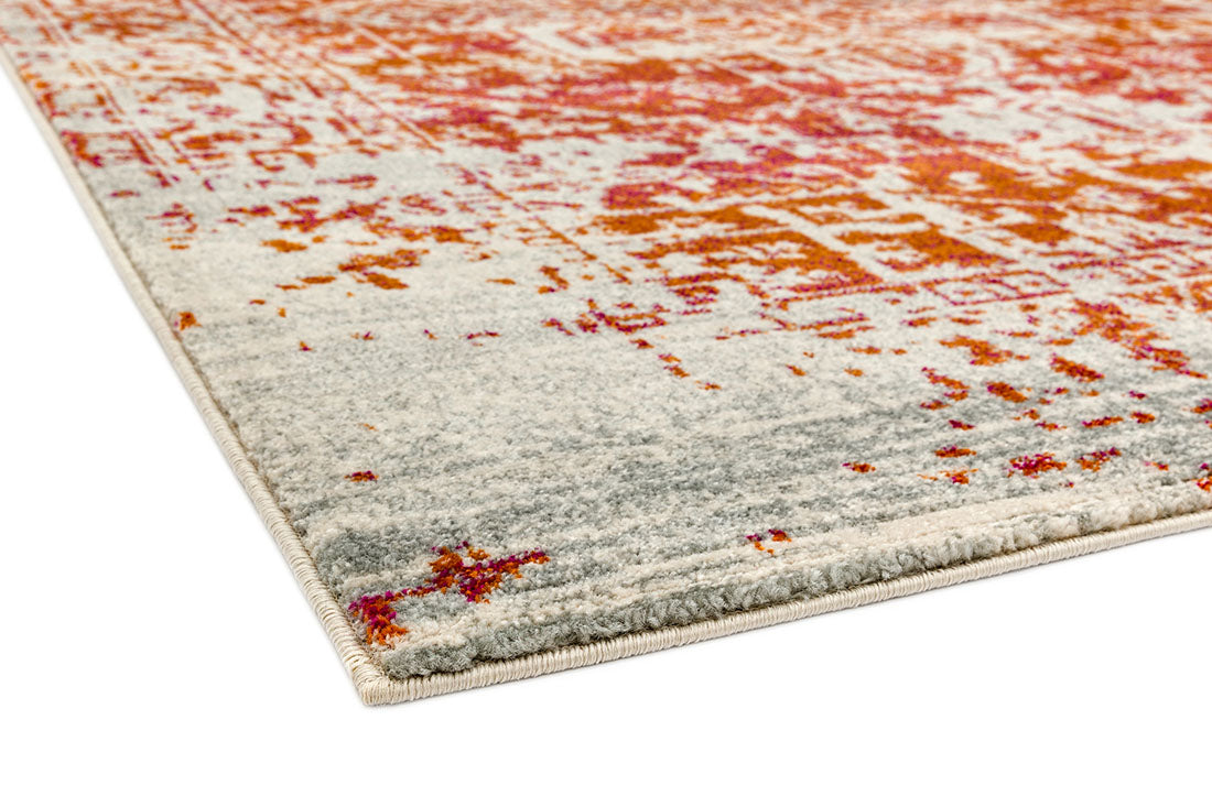 orange rug with an oriental design