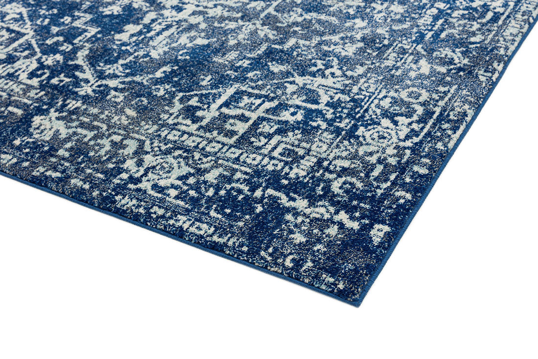 navy blue rug with an oriental design