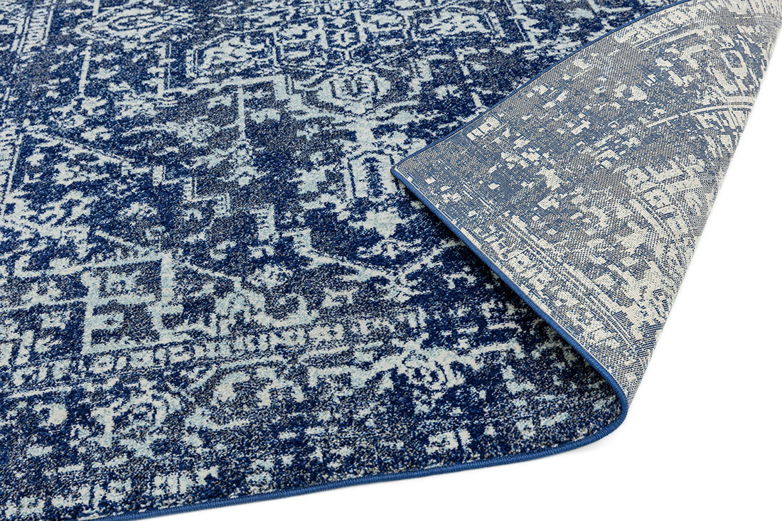navy blue rug with an oriental design