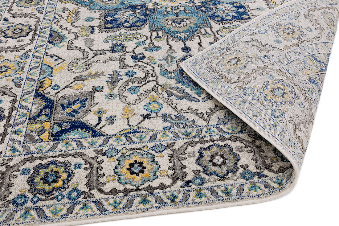 blue and white rug with an oriental design
