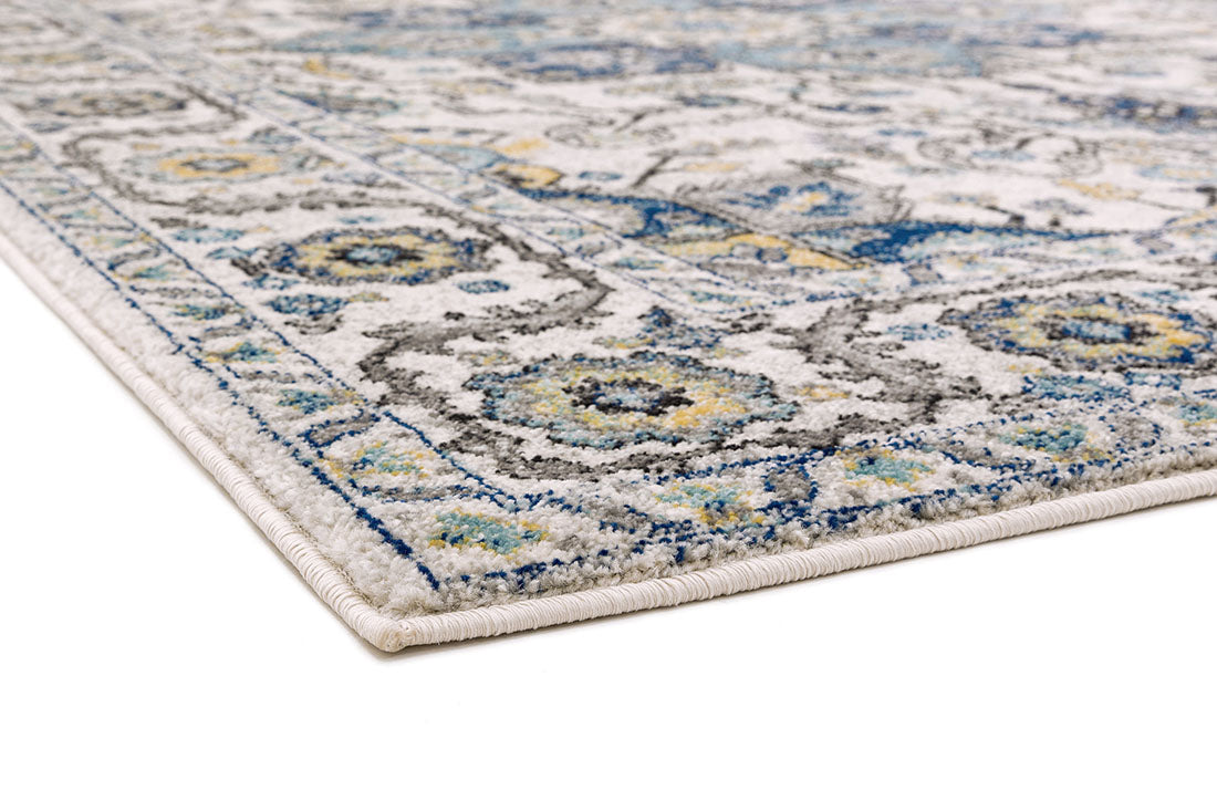 blue and white rug with an oriental design