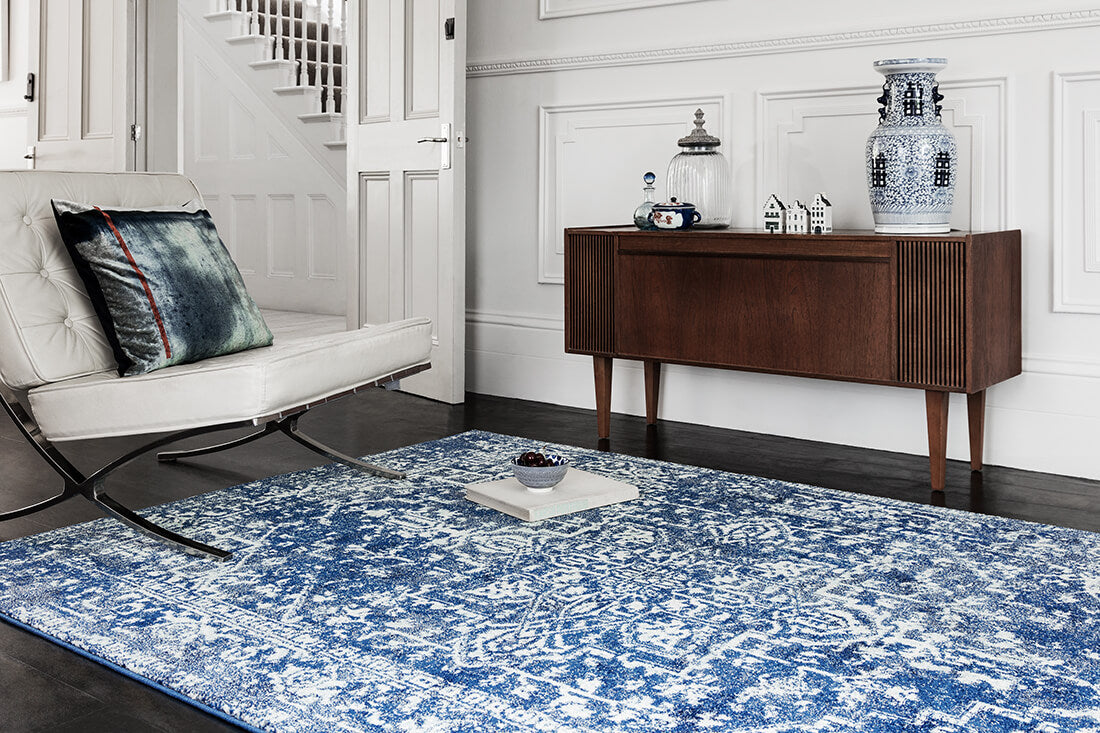 navy blue rug with an oriental design