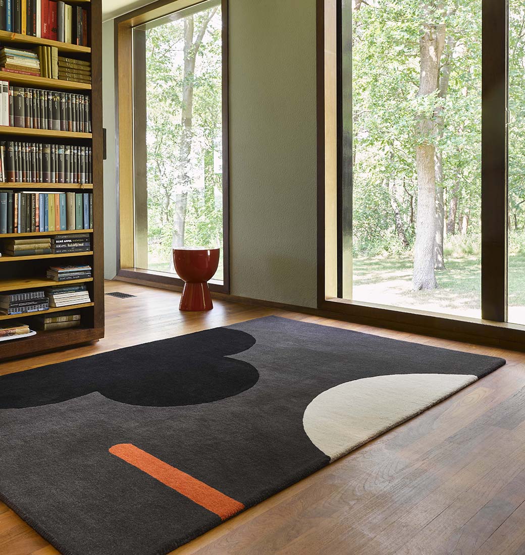 grey and black wool rug with retro floral design