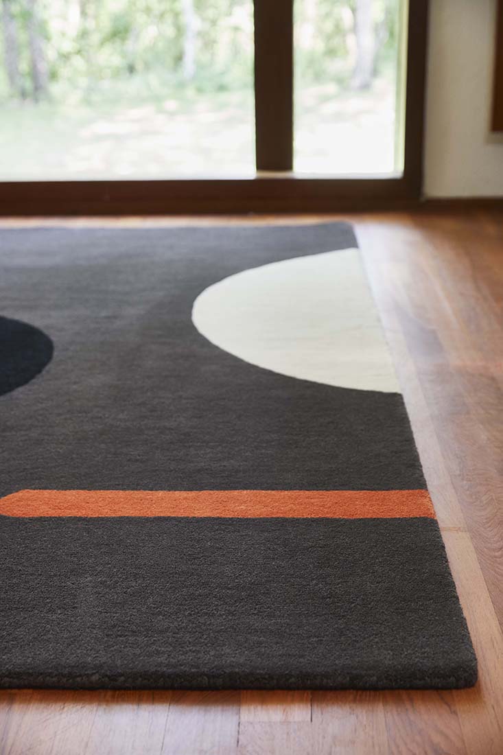 grey and black wool rug with retro floral design