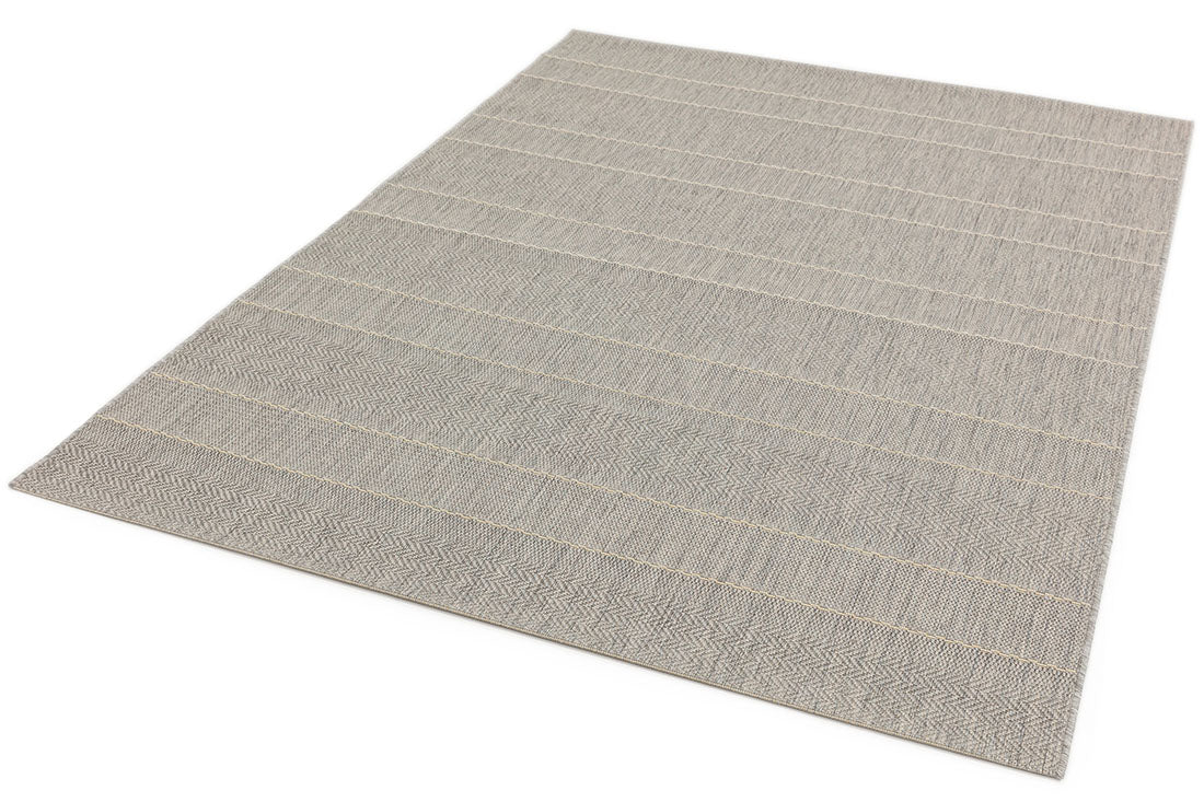 Woven beige and white rug with stripe pattern