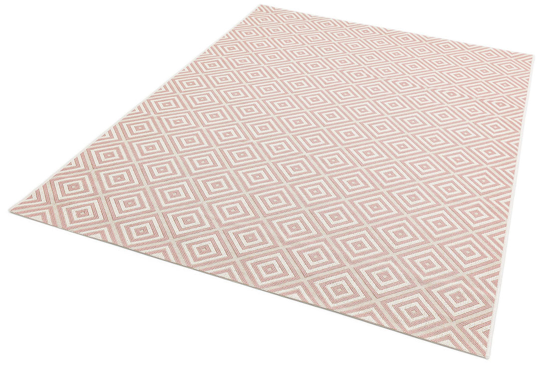 pink and white geometric rug for indoors and outdoors