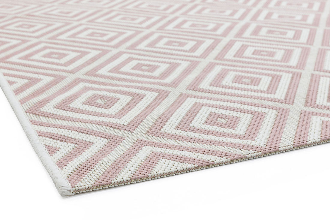 pink and white geometric rug for indoors and outdoors