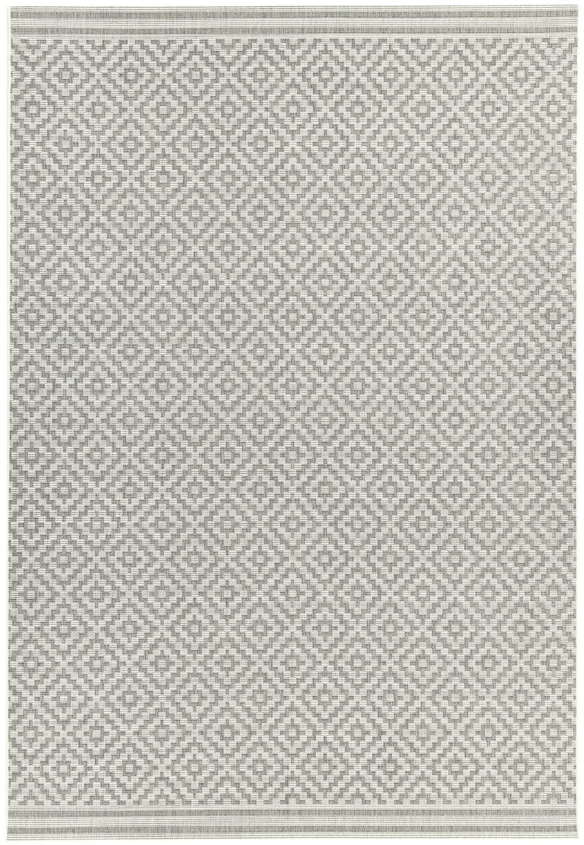Woven grey and white rug with a modern geometric diamond pattern