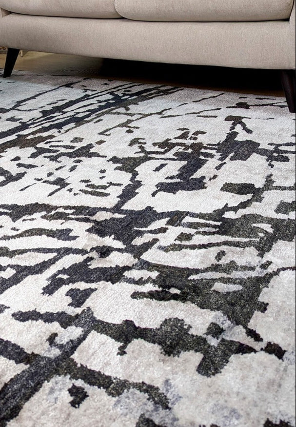 oriental rug with an abstract traditional pattern in grey