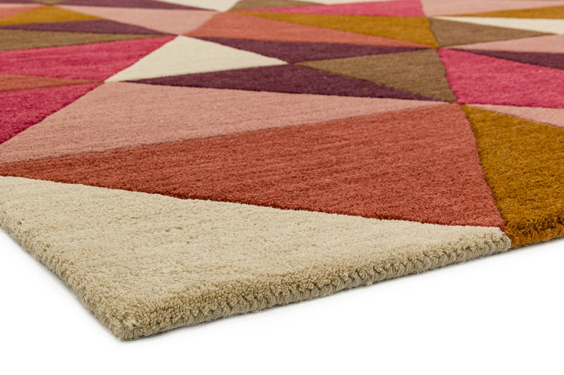 multicolour geometric rug in pink purple and brown