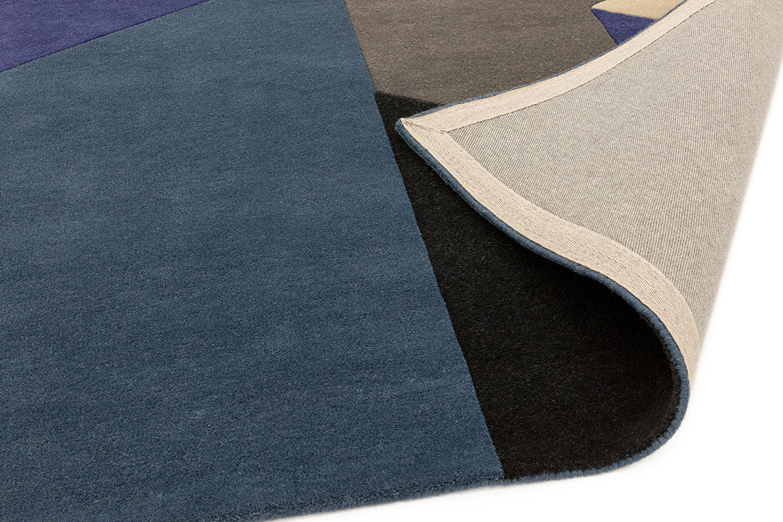 multicolour geometric rug in blue and black