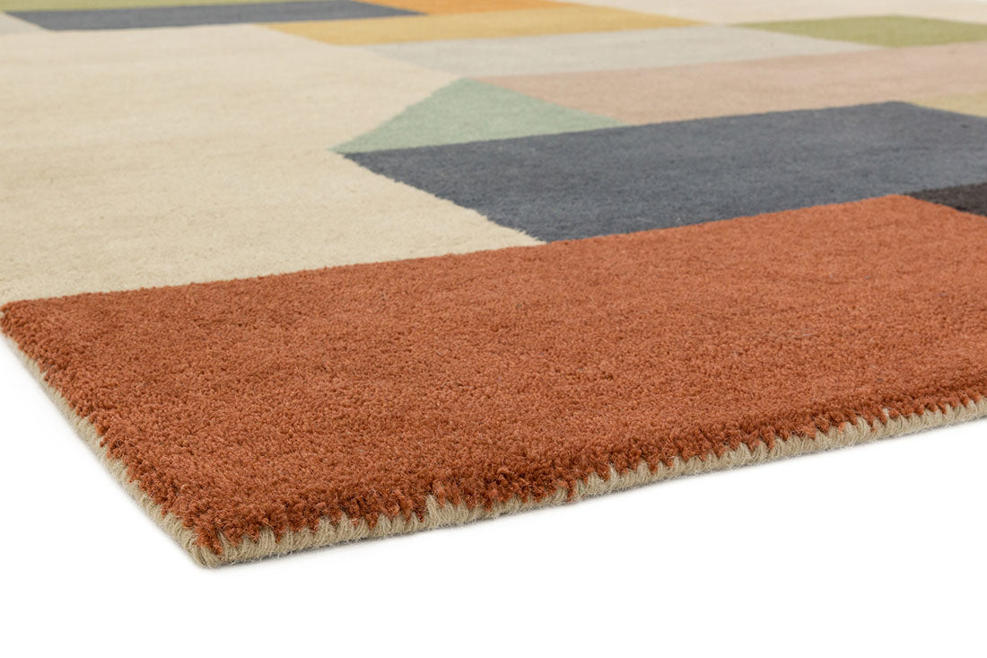 multicolour geometric rug in mustard yellow