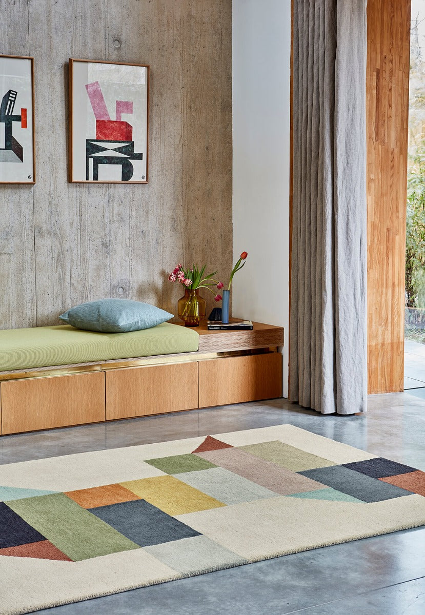 multicolour geometric rug in mustard yellow