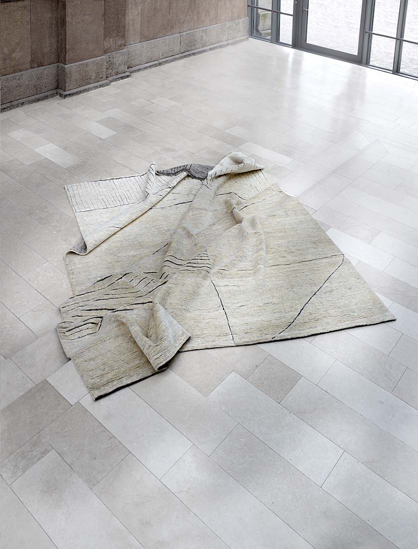 Cream area rug with abstract design