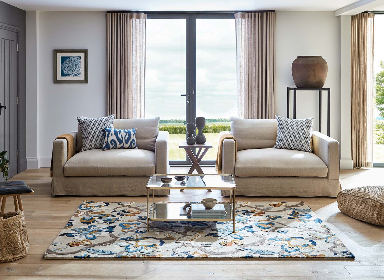 stone coloured wool and viscose rug with multicolour floral design