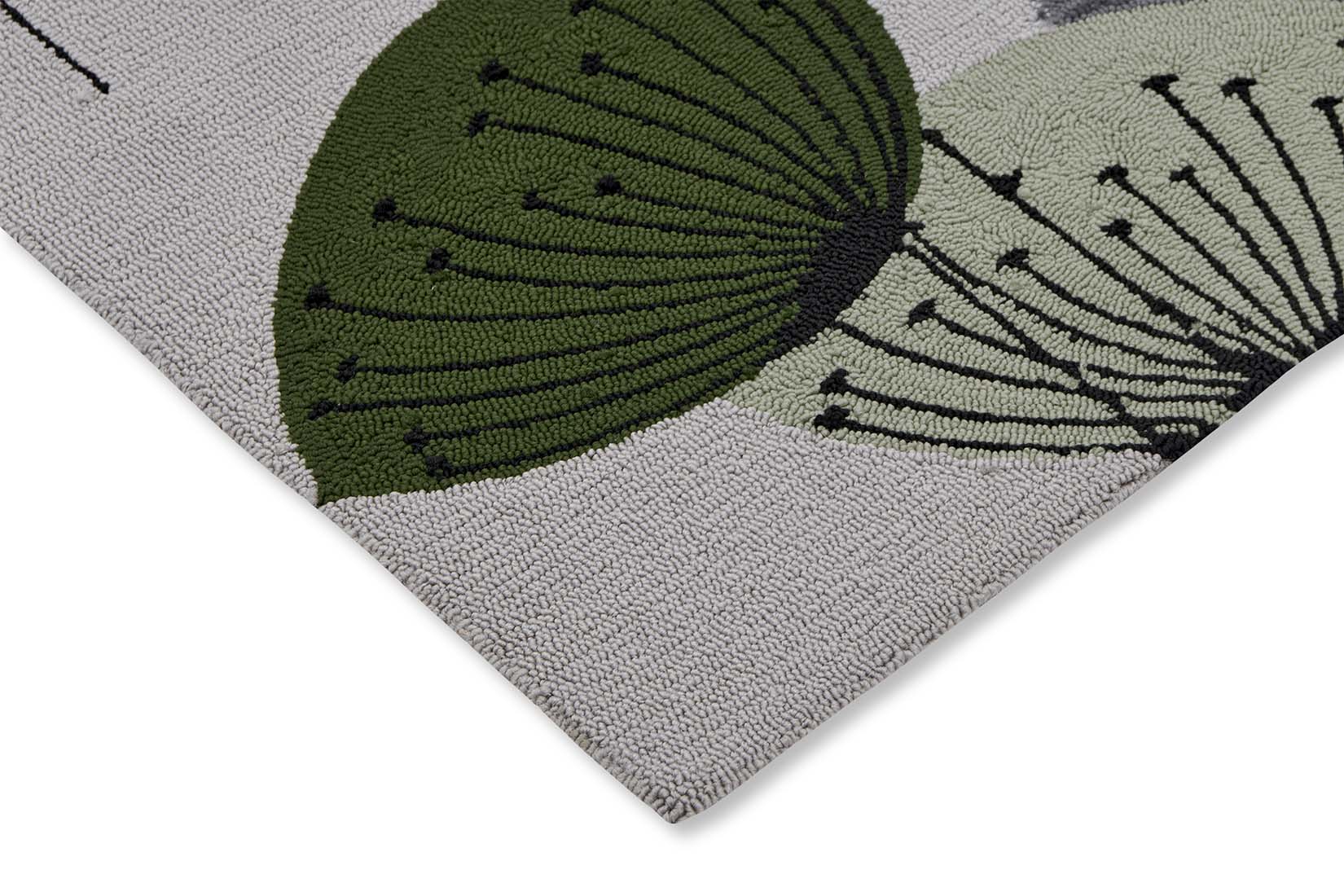 green and grey indoor/outdoor rug with dandelion pattern