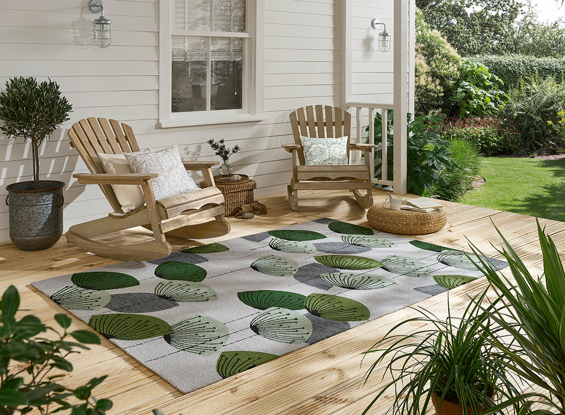 green and grey indoor/outdoor rug with dandelion pattern