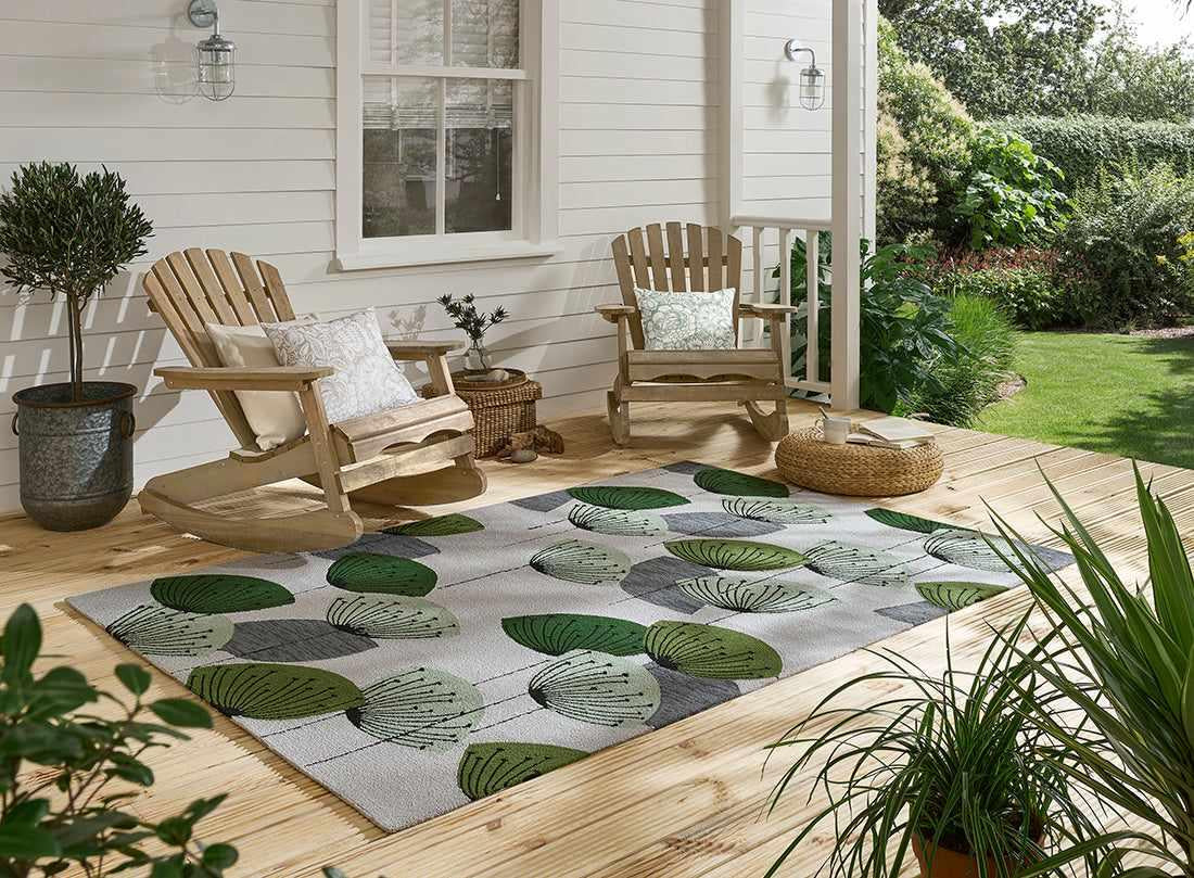 green and grey indoor/outdoor rug with dandelion pattern