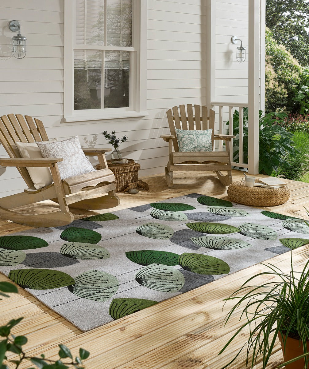 green and grey indoor/outdoor rug with dandelion pattern