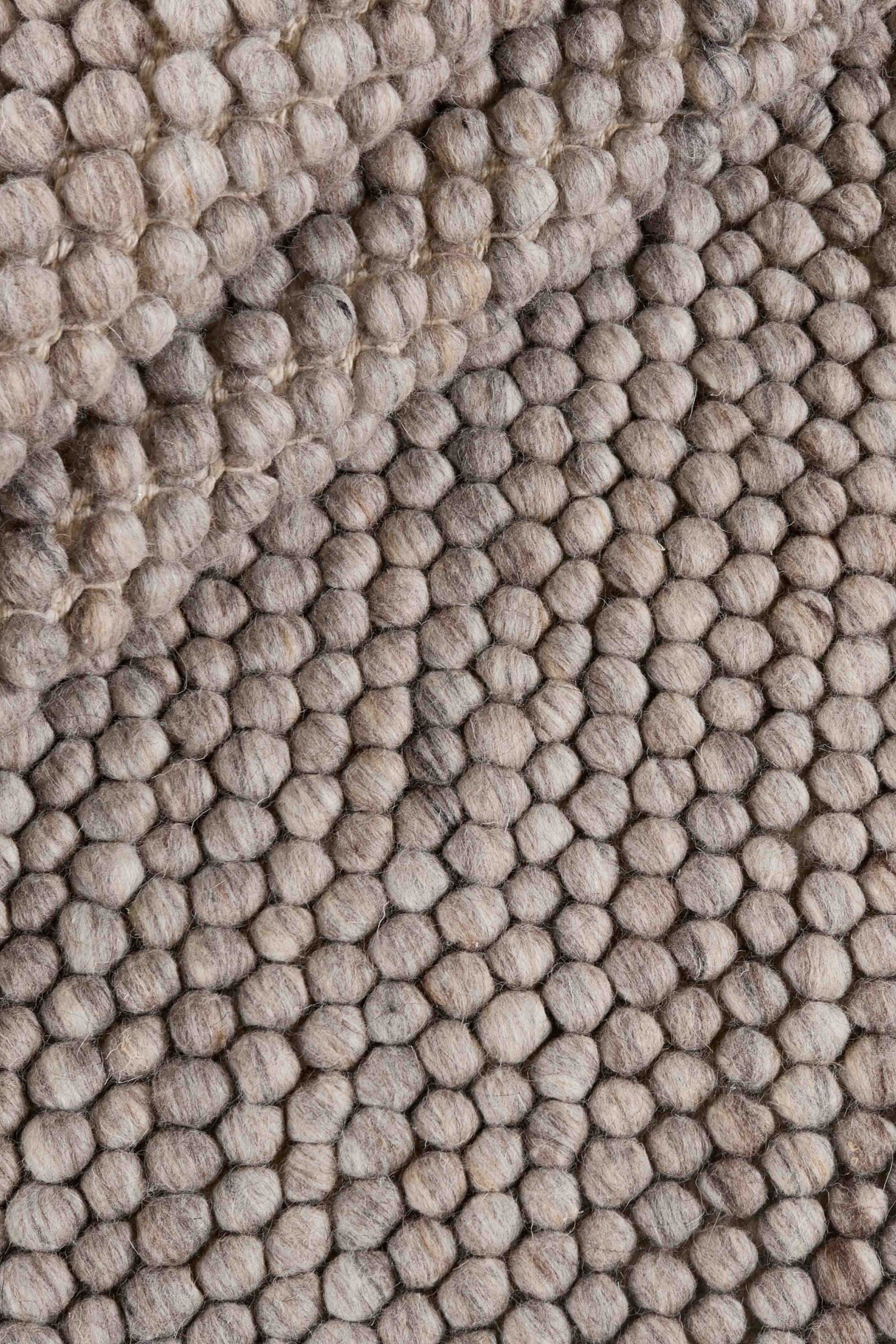 Beige textured wool rug