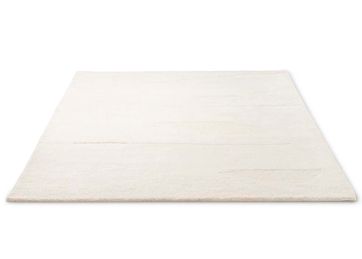 cream wool area rug with subtle texture detail