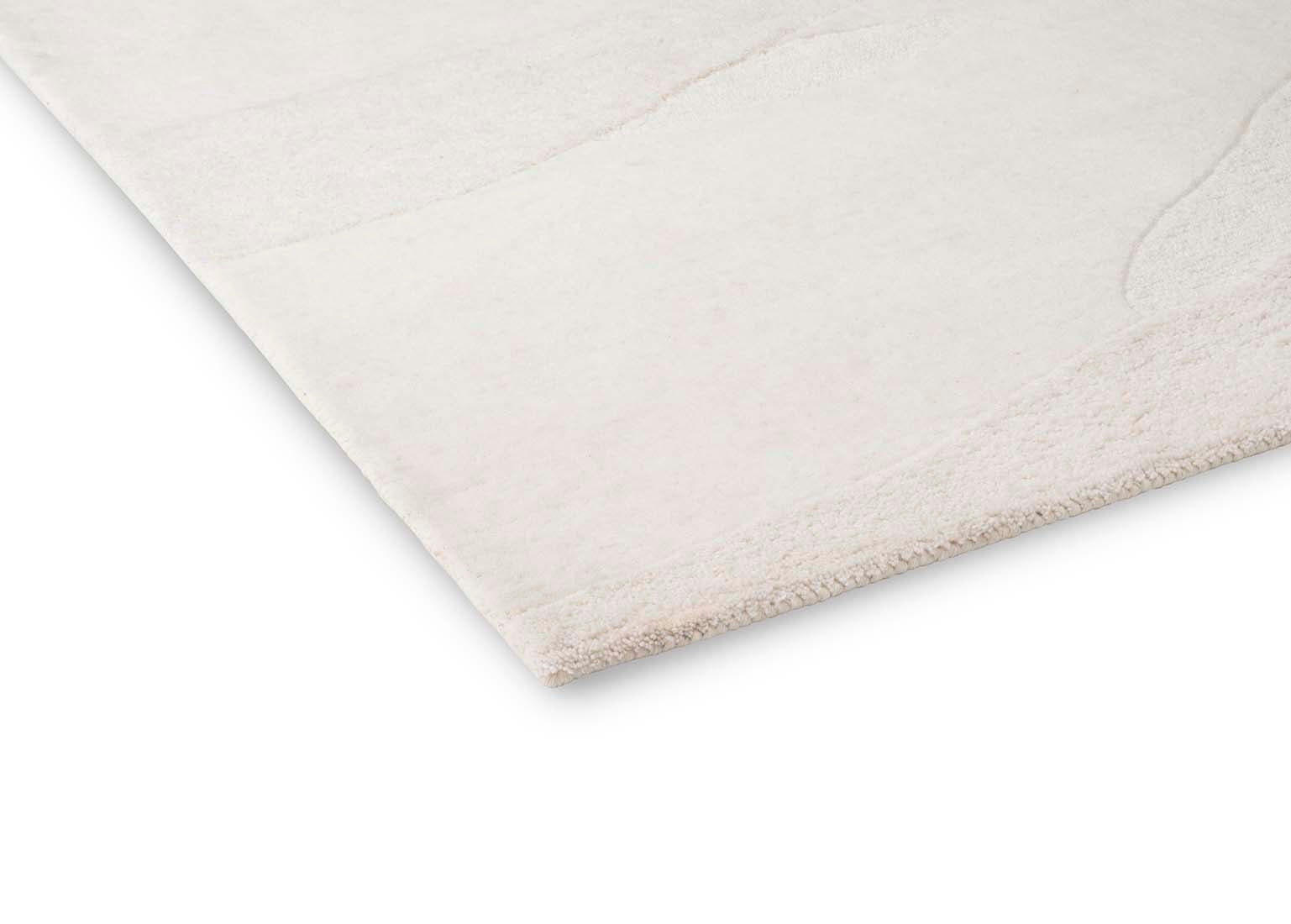 cream wool area rug with subtle texture detail