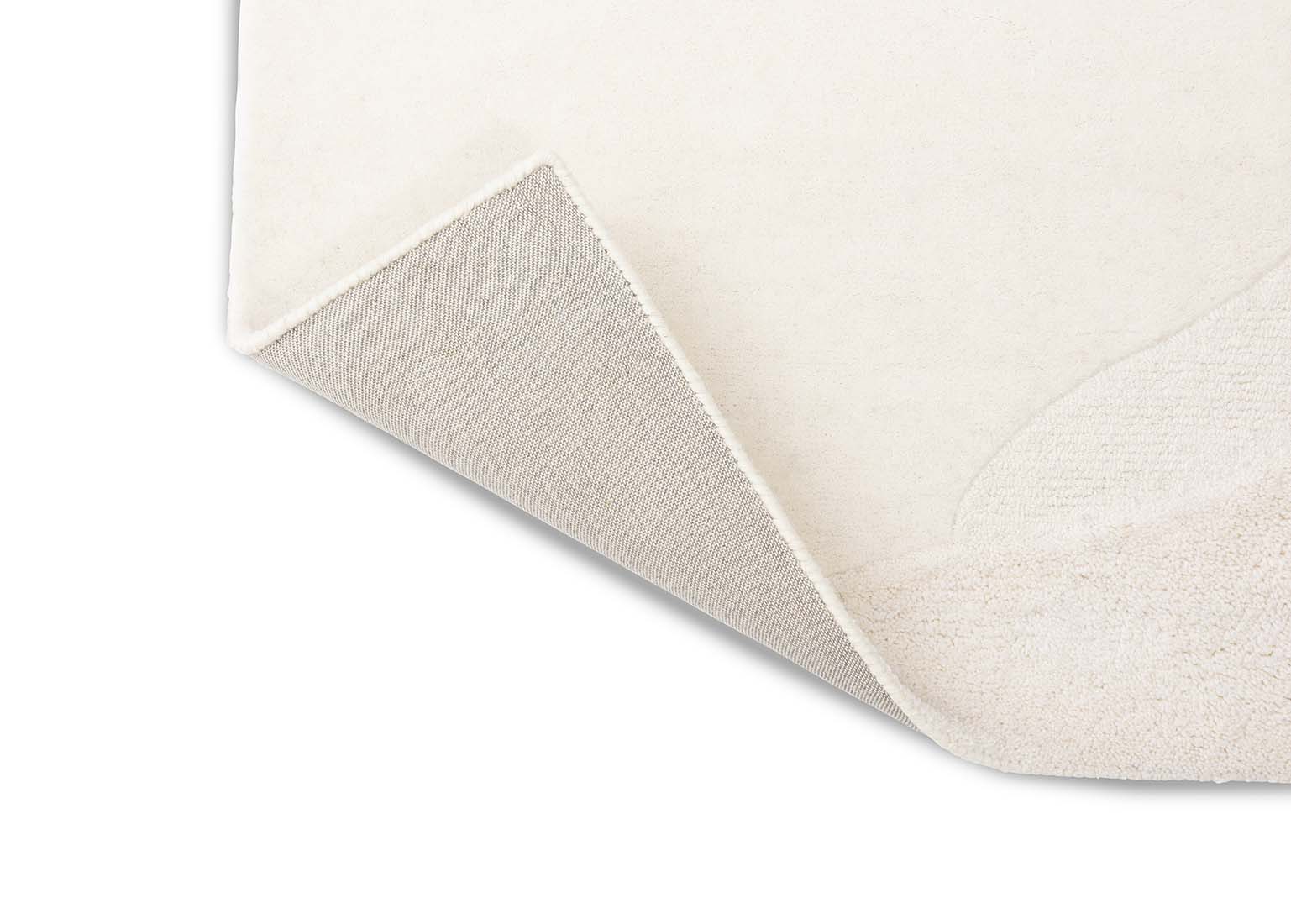 cream wool area rug with subtle texture detail