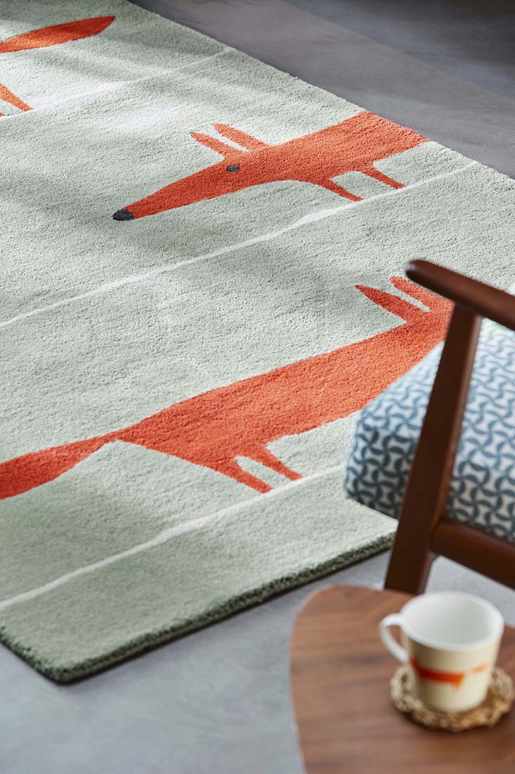 red and blue rug with fox print