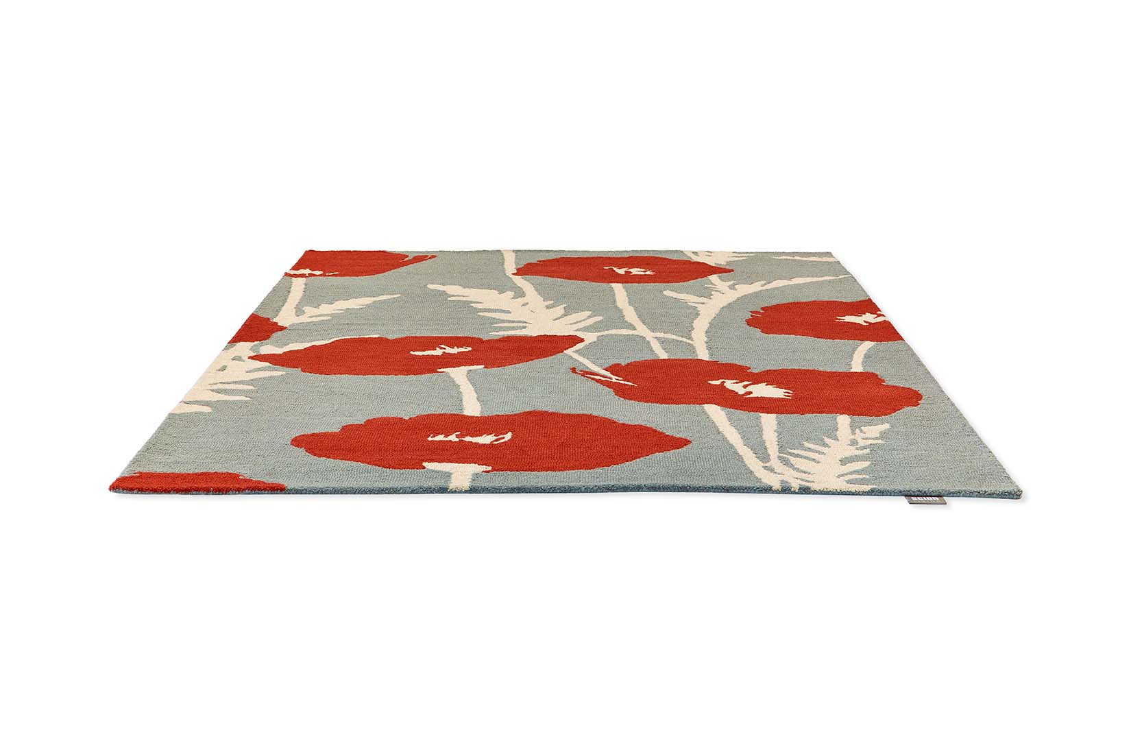 floral wool rug in red and sage. 
