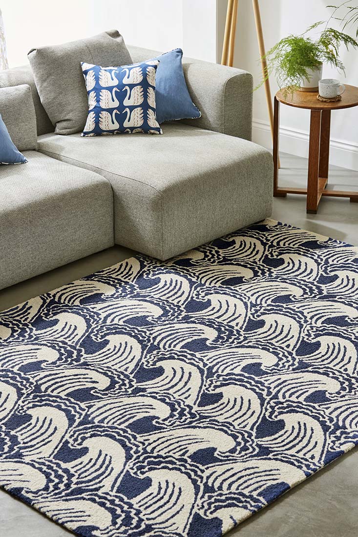 blue and beige rug with wave design
