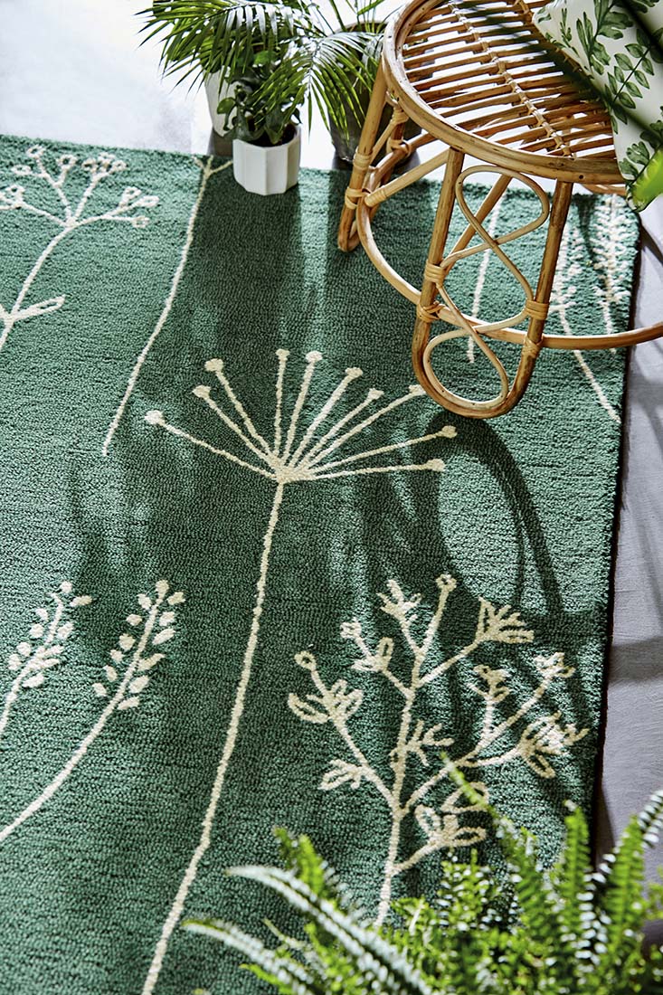 floral printed rug in green and ivory
