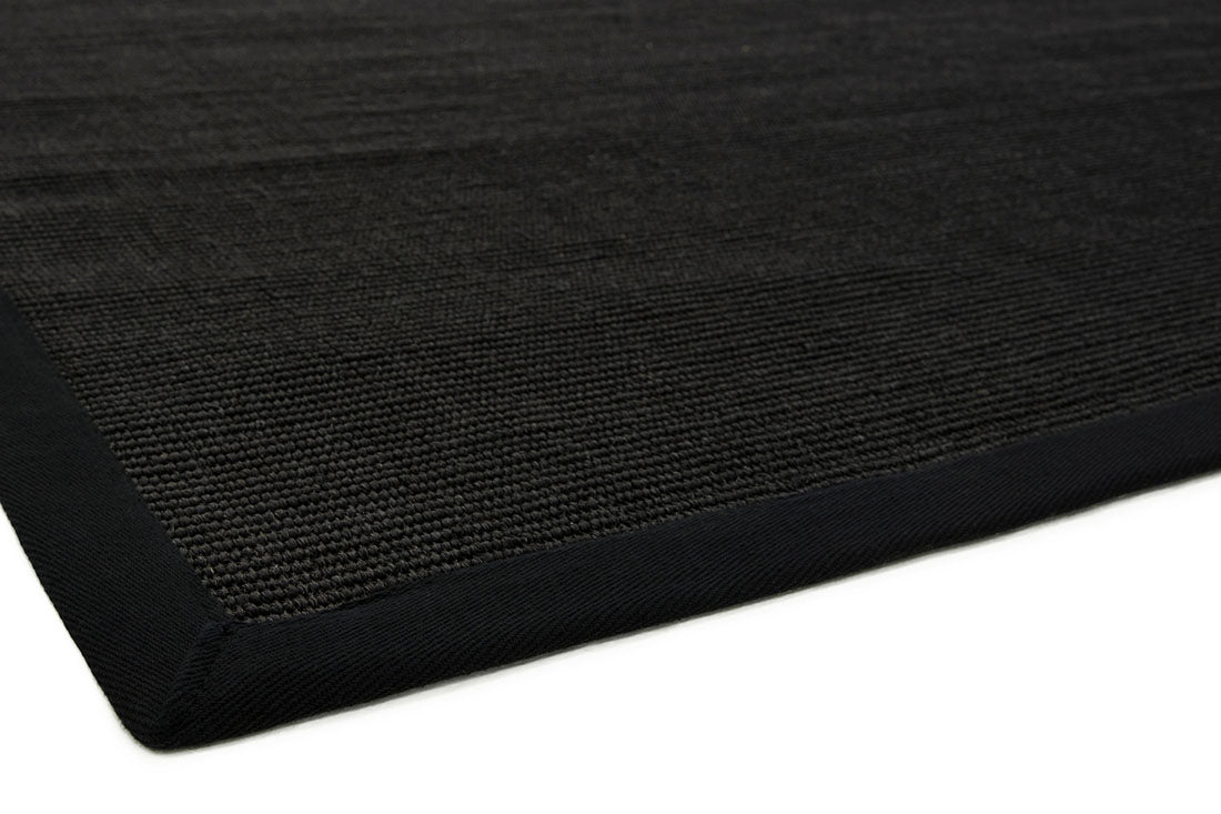 black sisal rug with a black border