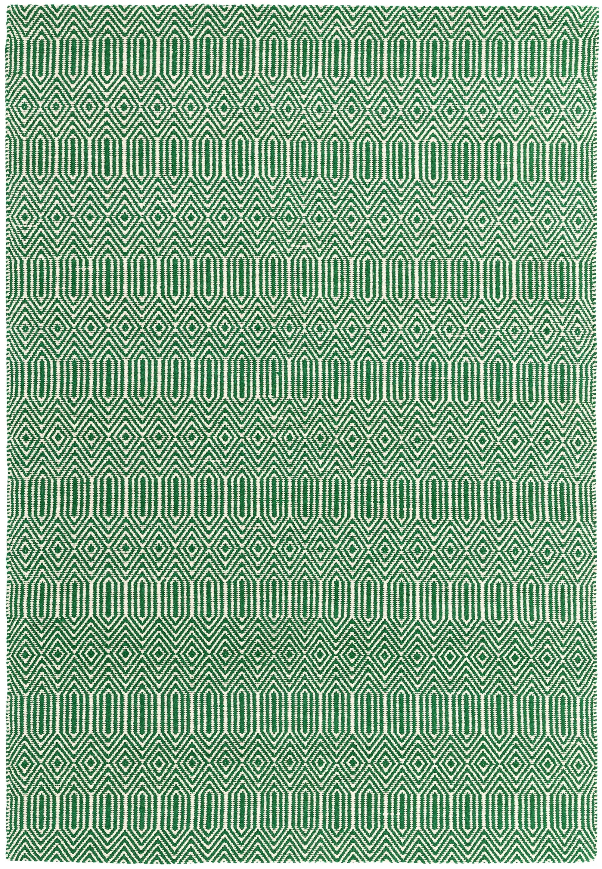 Green woven rug with aztec chevron pattern