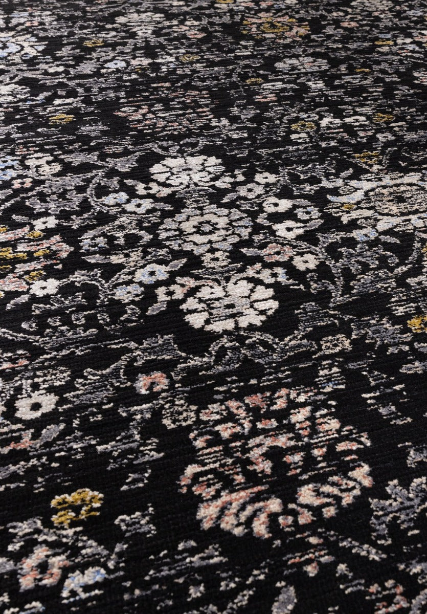 Vintage style rug in distressed black floral print
