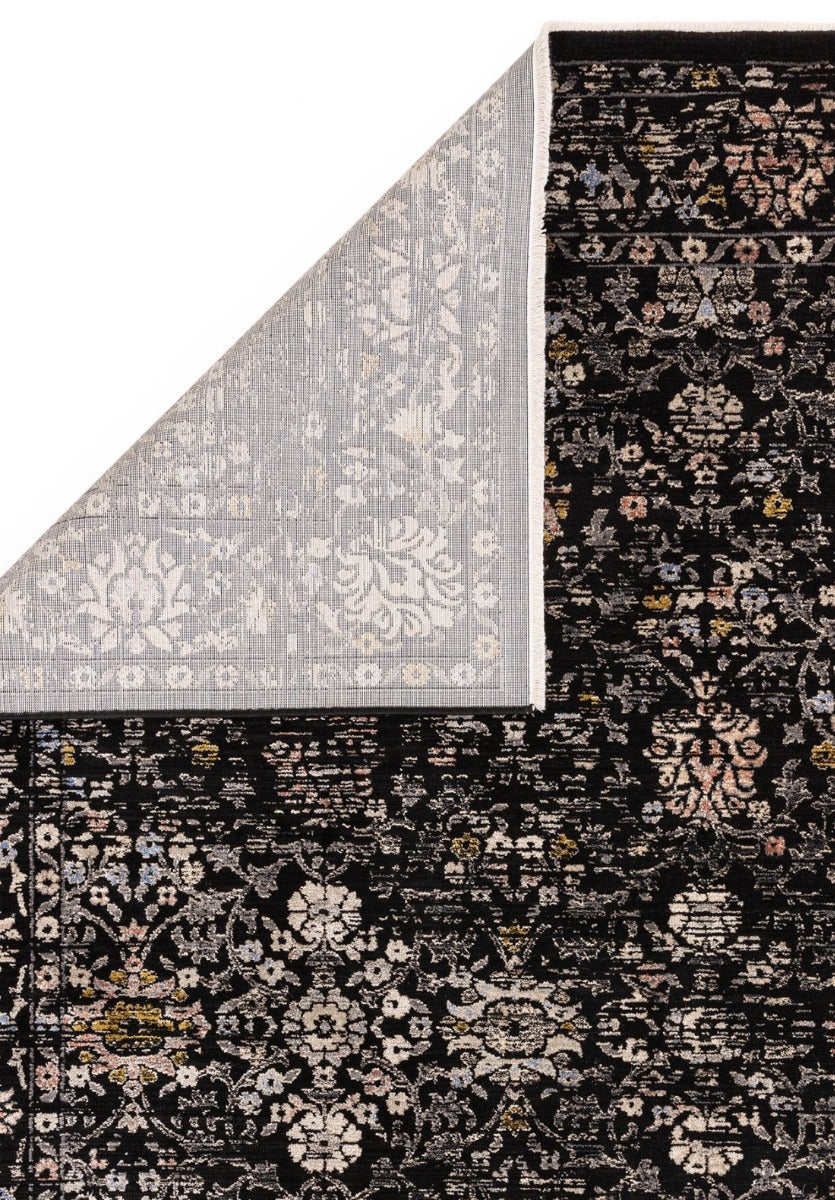 Vintage style rug in distressed black floral print