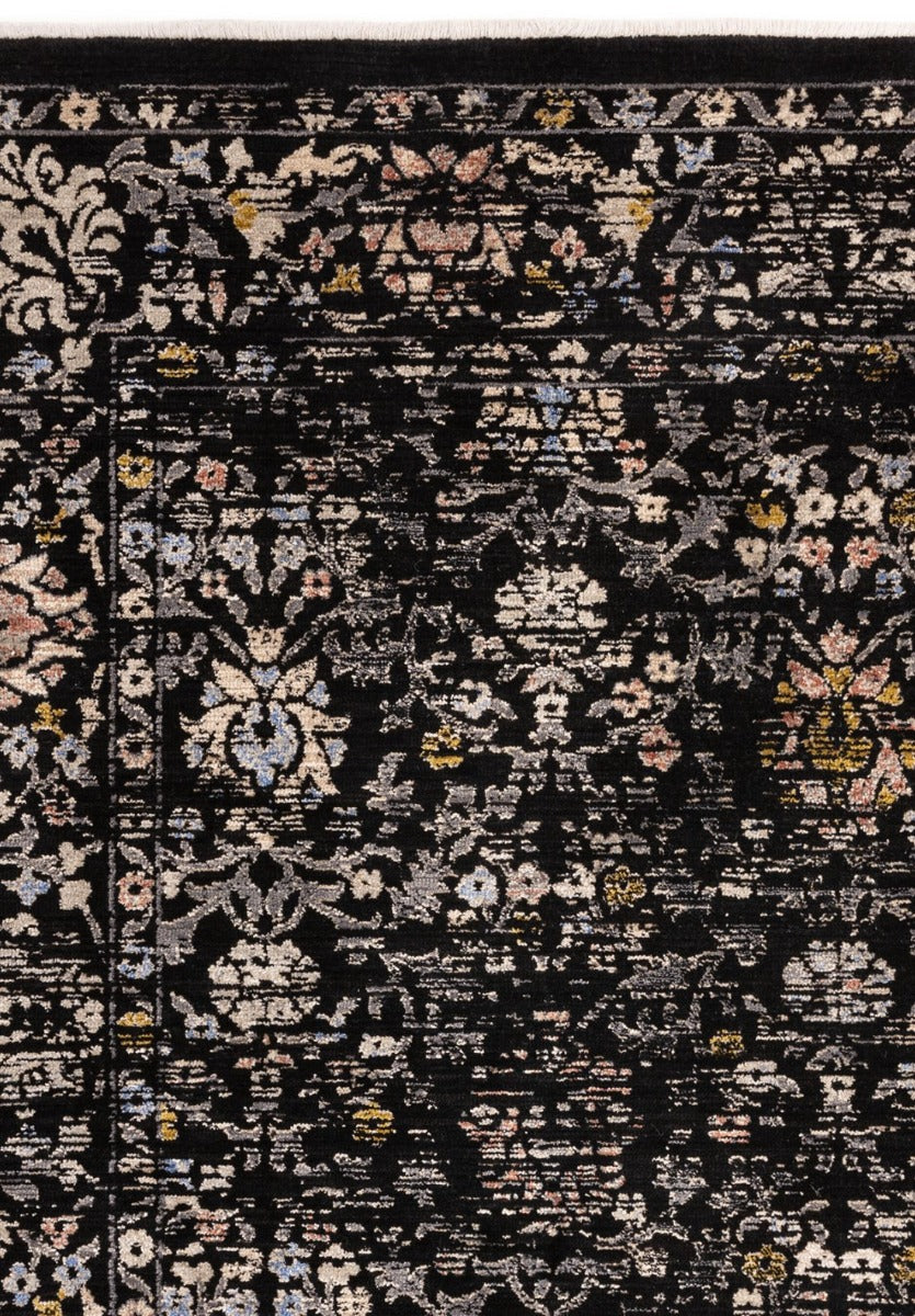 Vintage style rug in distressed black floral print